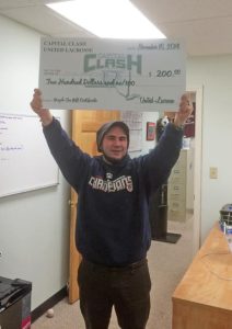 Rob holding Capital Clash winning check
