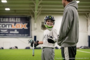 Lacrosse coach and young player