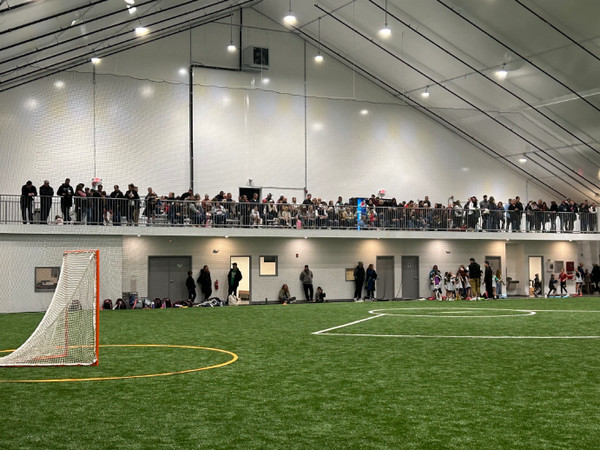 HGR lacrosse indoor field with people in balcony