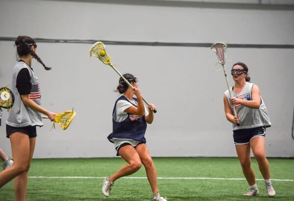 HGR Lacrosse Girls Team playing indoor lacrosse